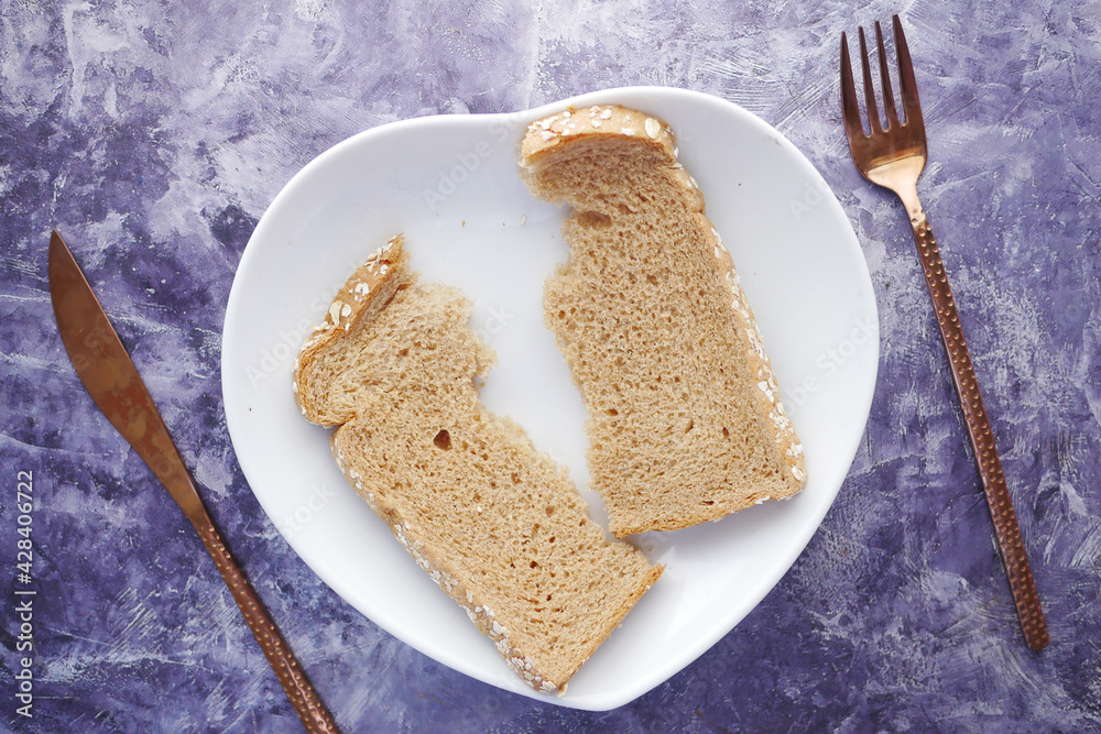close up of slice of baked bread on plate on table close up of slice of baked bread on plate on table