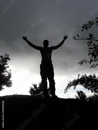 boy back light shot in deep green forests feeling the true nature