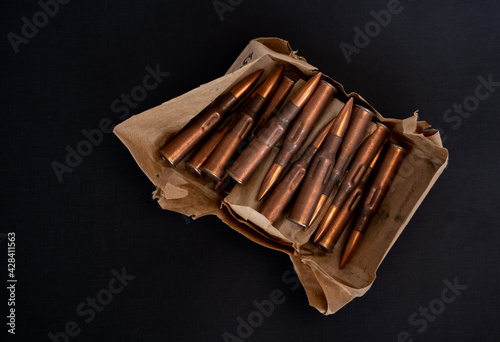 Cartridges 7.62x54 SVD (Dragunov sniper rifle) on a black background photo