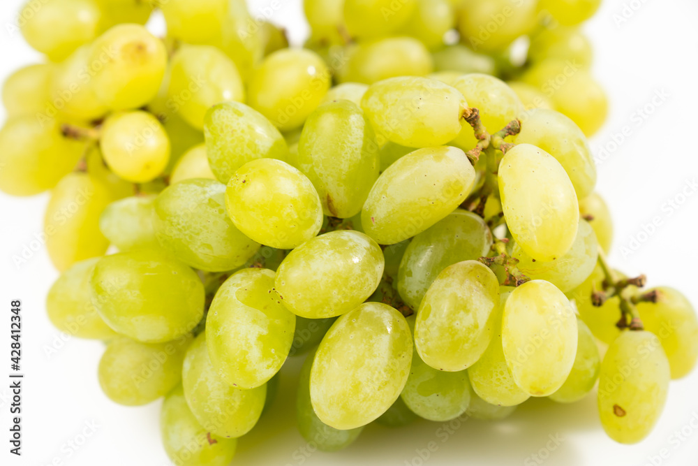 ripe green grapes on a white background. sweet juicy berries. Farm organic products ripe green grapes on a white background. sweet juicy berries. Farm organic products