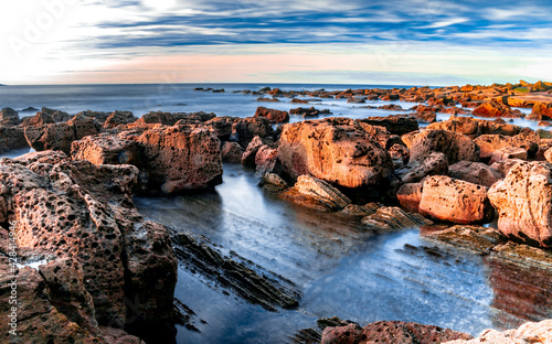 Sea and rocks in sunset