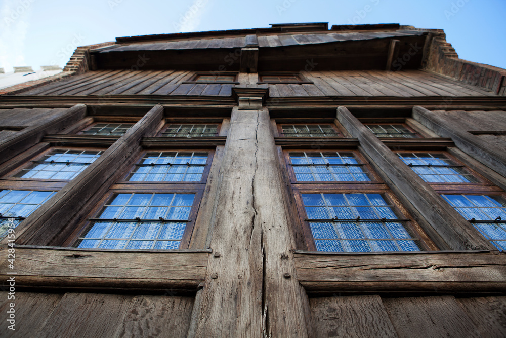 Obraz premium Facade of an old Medieval wooden house in the center of Bruges, an Unesco World Heritage Site in Flanders, Belgium, Europe