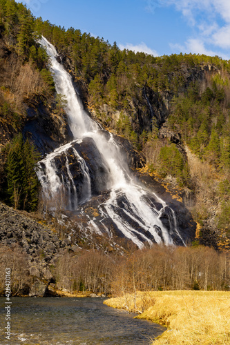 Vidfoss is a waterfall located in the municipality of Ullensvang in Vestland County, Norway photo