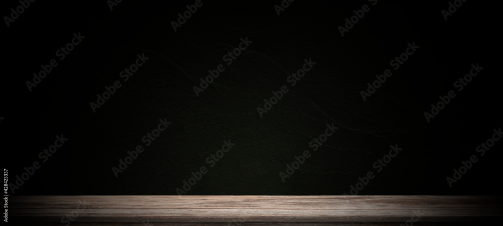 Wooden old tabletop and dark plaster wall background for montage product display or design key visual layou. Wooden old tabletop and dark plaster wall background for montage product display or design key visual layou.