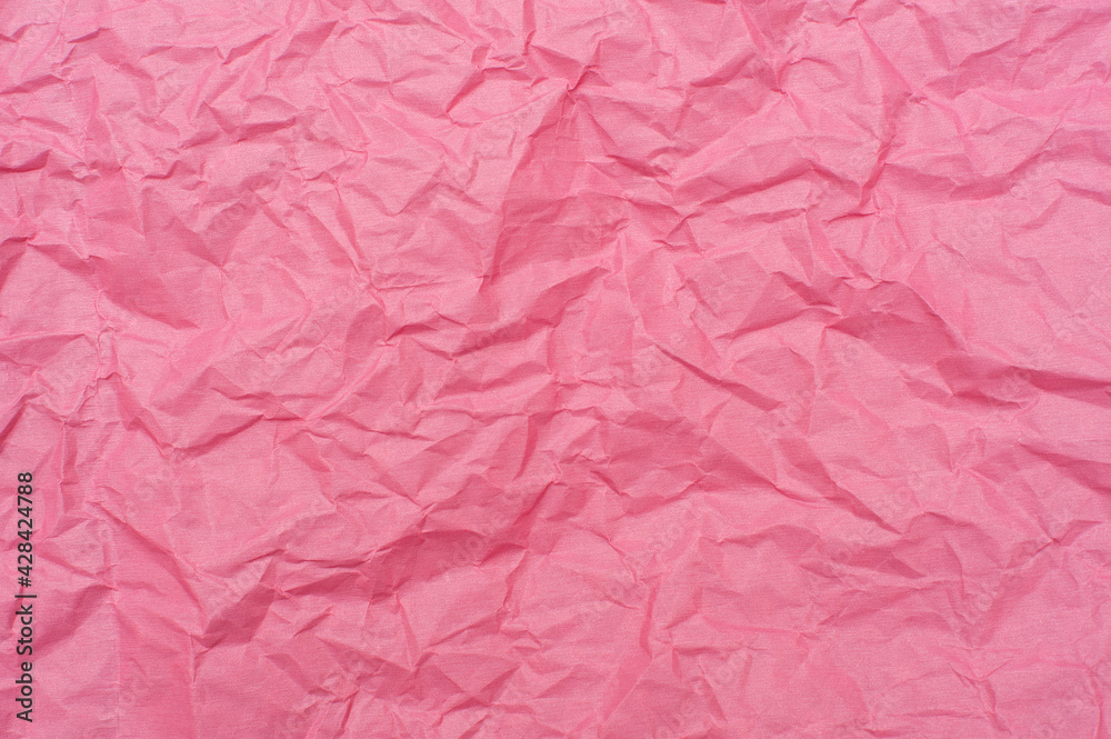 Fototapeta premium Crumpled pink background. Pink paper, texture and backgrounds.
