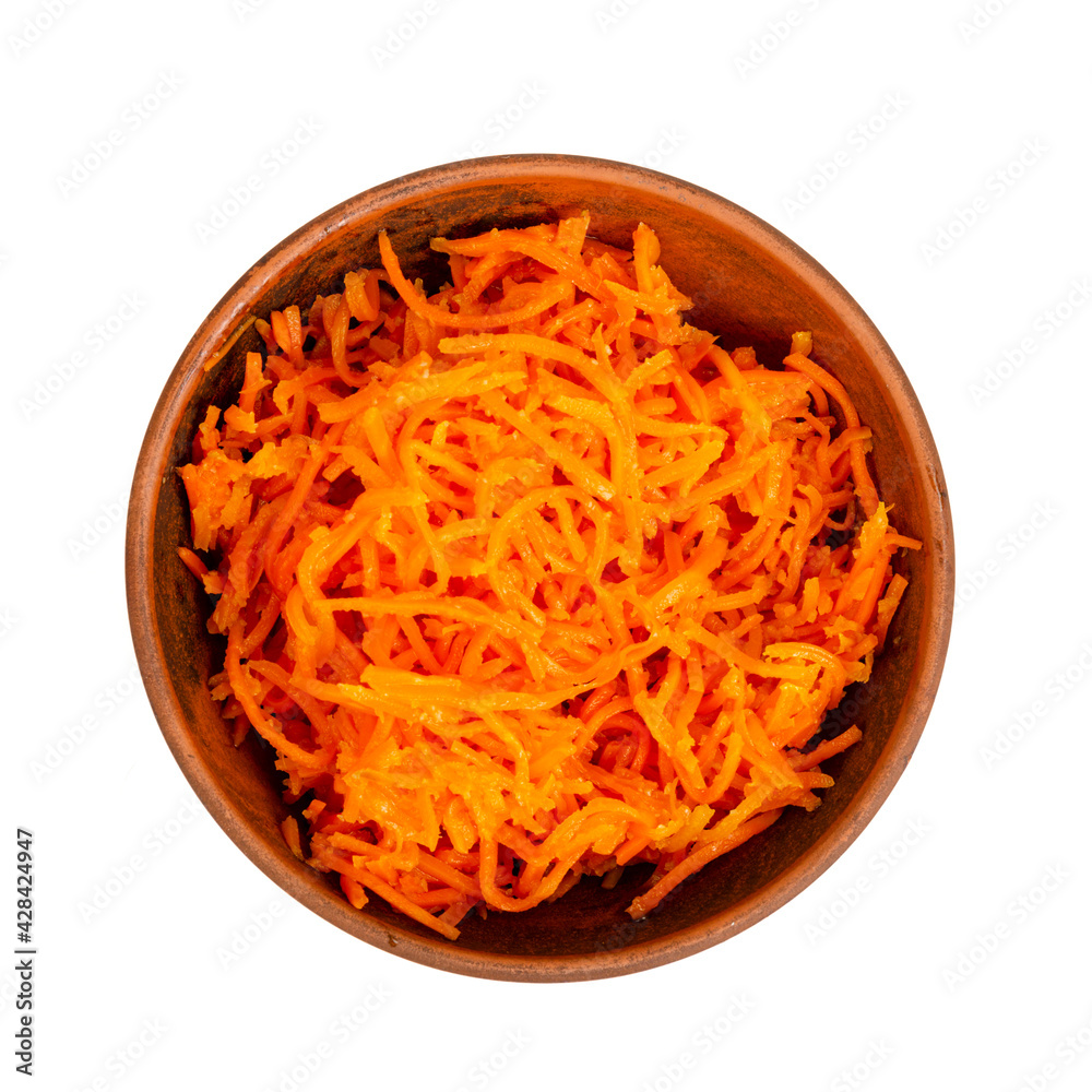 Spicy pickled carrots in bowl on white plate. Spicy pickled carrots in bowl on white plate.