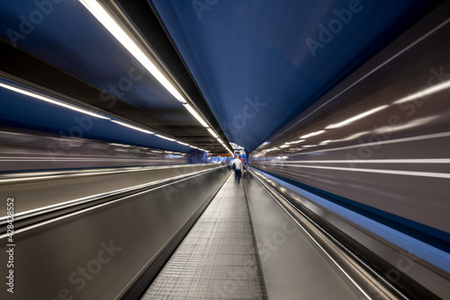 Zoom effect for speed blue and silver on a escalator