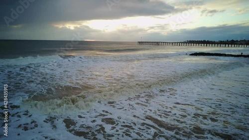  Right lateral low aerial shot of shore on the ocean