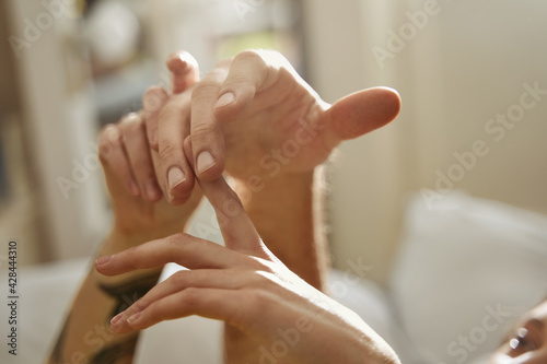 Couple in love touching with hands to each other while spending their morning