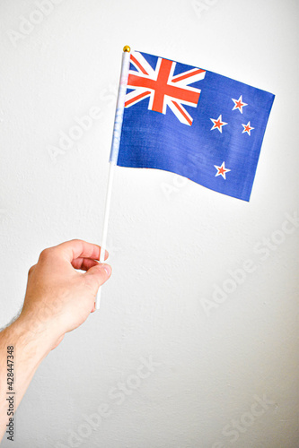 Hand holding hand flag of Australia © Daniel