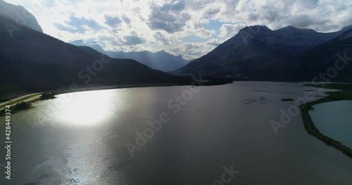 Vast body of water with mountains in the background - slow motion