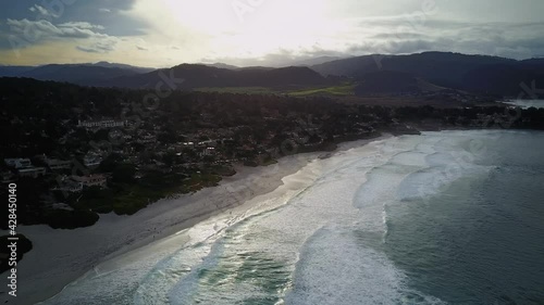 Wide aerial ascending shot of ocean in California