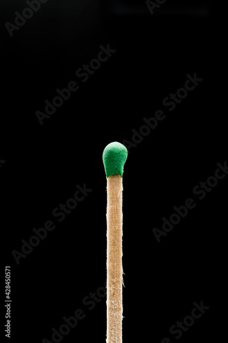 a match on a black background pending arson - Image