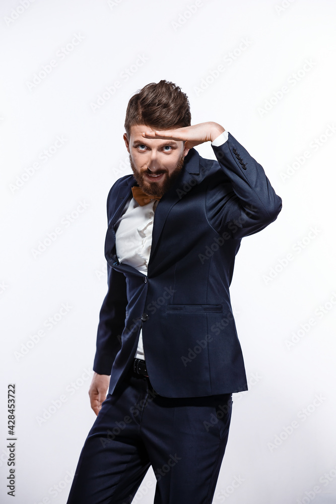 Elegant young handsome man in black classic costume. Studio fashion portrait. Elegant young handsome man in black classic costume. Studio fashion portrait.