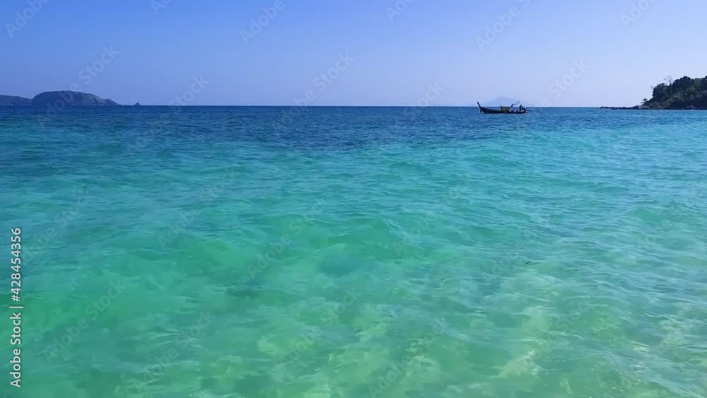 Krabi Island Long Boat moored in the sea, bright emerald green water, tourism, snorkeling, White sand beach travel summer Thailand Krabi Island Long Boat moored in the sea, bright emerald green water, tourism, snorkeling, White sand beach travel summer Thailand