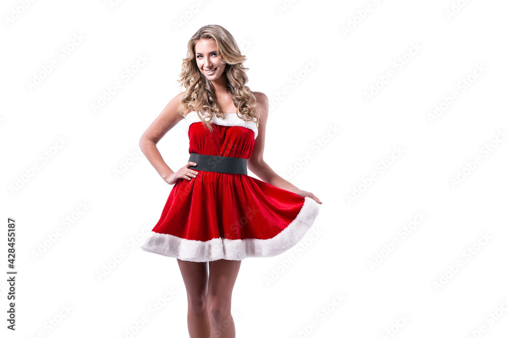 Portrait of a blonde woman dressed in red New Year costume standing isolated over white background. Isolate