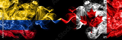 Colombia  Colombian vs Canada  Canadian smoky mystic flags placed side by side. Thick colored silky abstract smokes flags.