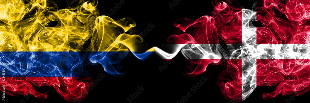 Colombia, Colombian vs Denmark, Danish smoky mystic flags placed side by side. Thick colored silky abstract smokes flags.