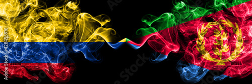 Colombia  Colombian vs Eritrea  Eritrean smoky mystic flags placed side by side. Thick colored silky abstract smokes flags.