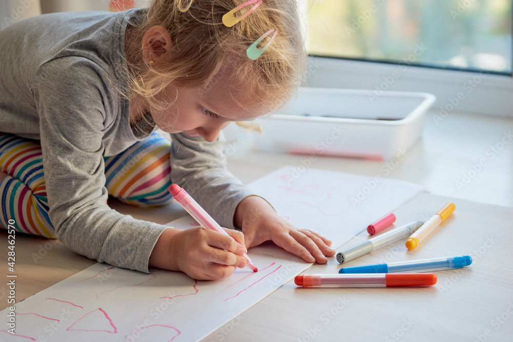 3 years girl draws a picture. Child at home, kindergarden and preschool closed during Covid-19 3 years girl draws a picture. Child at home, kindergarden and preschool closed during Covid-19