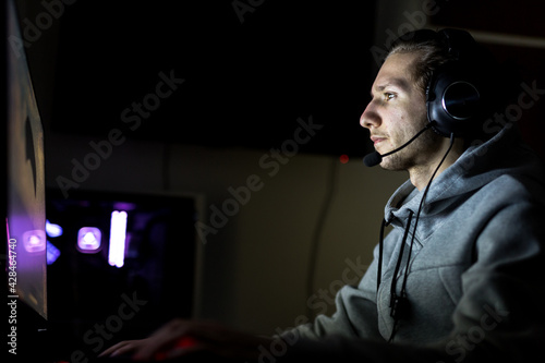 Obraz na plátně Professional Gamer or Streamer Playing First-Person Shooter Onli