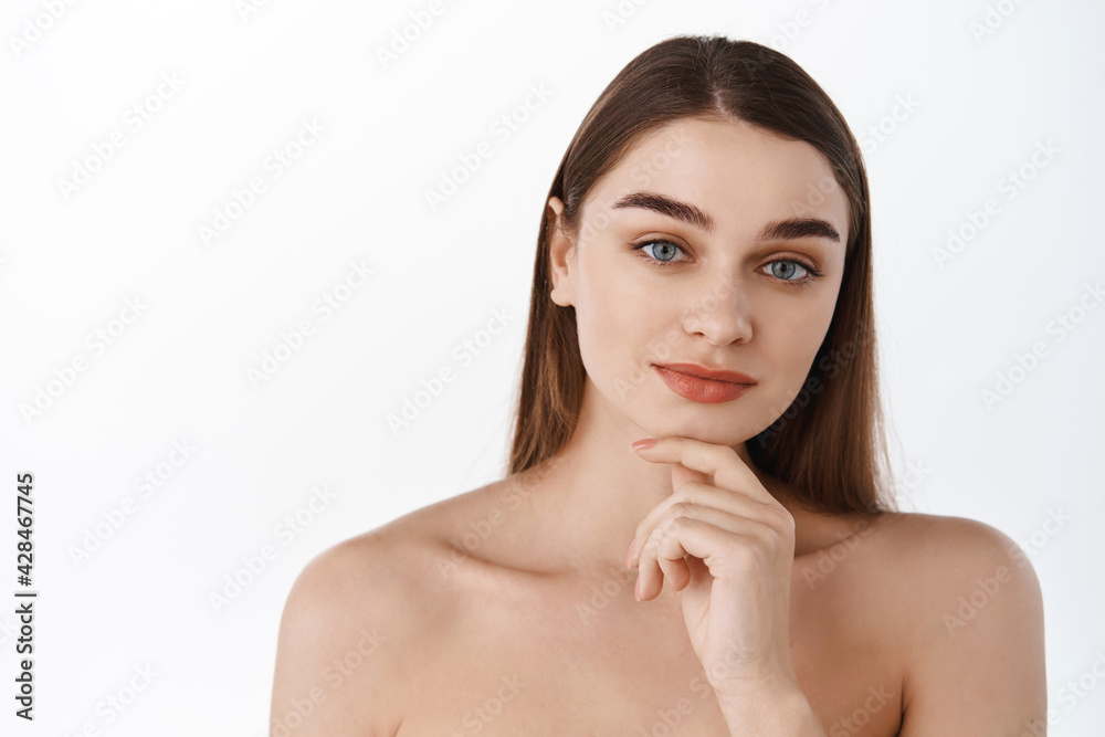 Beauty woman healthy skin concept natural makeup beautiful model girl face hands touching with manicure nails. Spa and skincare beauty concept. Young female look thoughtful at camera Beauty woman healthy skin concept natural makeup beautiful model girl face hands touching with manicure nails. Spa and skincare beauty concept. Young female look thoughtful at camera