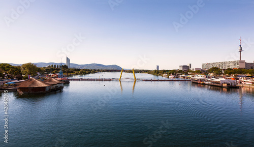 View of the Danube and the pontoon bridge connecting the Leopoldstadt and Donaustadt districts of Vienna at sunset. Austria © vesta48