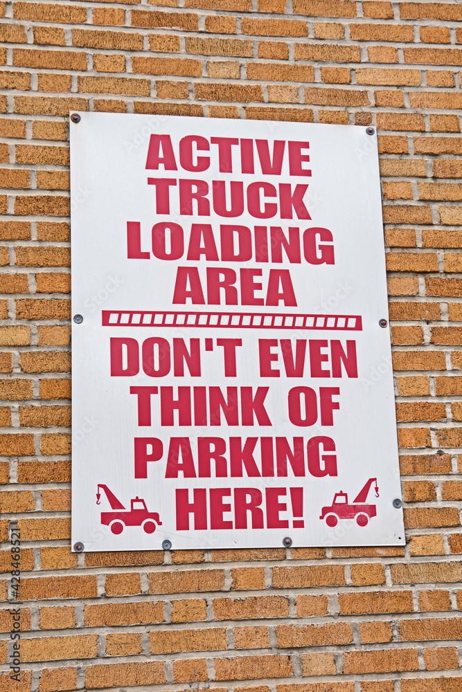 Fototapeta premium An imaginative sign for a truck loading area tells motorists not to park there in no uncertain terms.