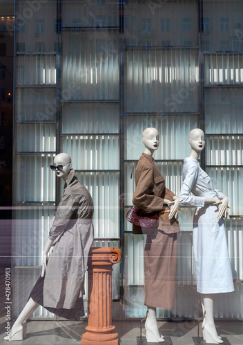 Wallpaper Mural Three female mannequins in a shop window. Sale of women's clothing. Torontodigital.ca