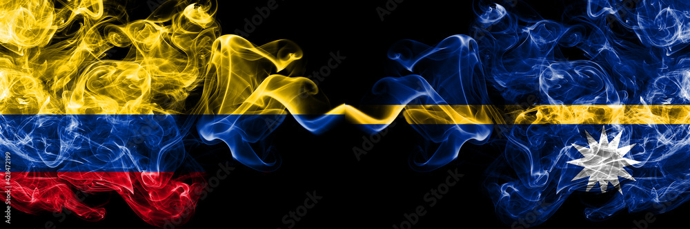 Colombia, Colombian vs Nauru, Nauruan smoky mystic flags placed side by side. Thick colored silky abstract smokes flags.