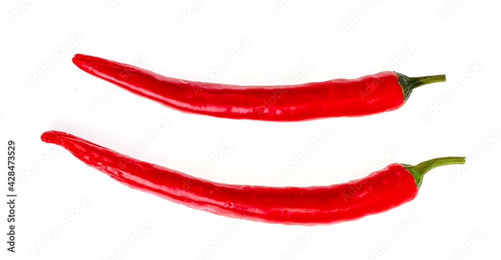Two red hot chilli peppers isolated on white background. Two red hot chilli peppers isolated on white background.