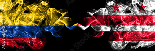 Colombia, Colombian vs United States of America, America, US, USA, American, District of Columbia, Washington smoky mystic flags placed side by side. Thick colored silky abstract smokes flags.