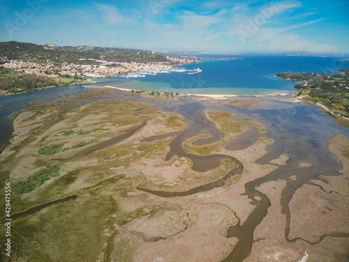 Aerial view of golfo di Arzachena bay, cannigione village port and swamp photo