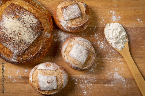 Traditional Italian bread with natural fermentation. Wooden base and top view.