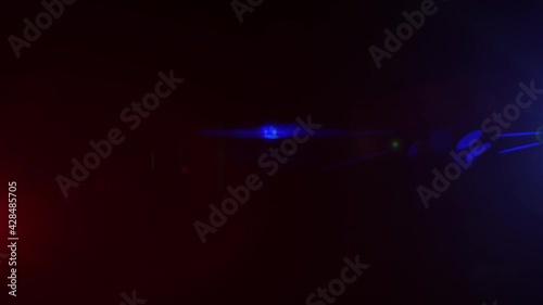 Red and Blue Lights Police Beacon isolated on a black background. Light leaks Glowing in 4K 60FPS seamless loop. Ambulance Emergency flashing light. Optical Lens Flare Effect.