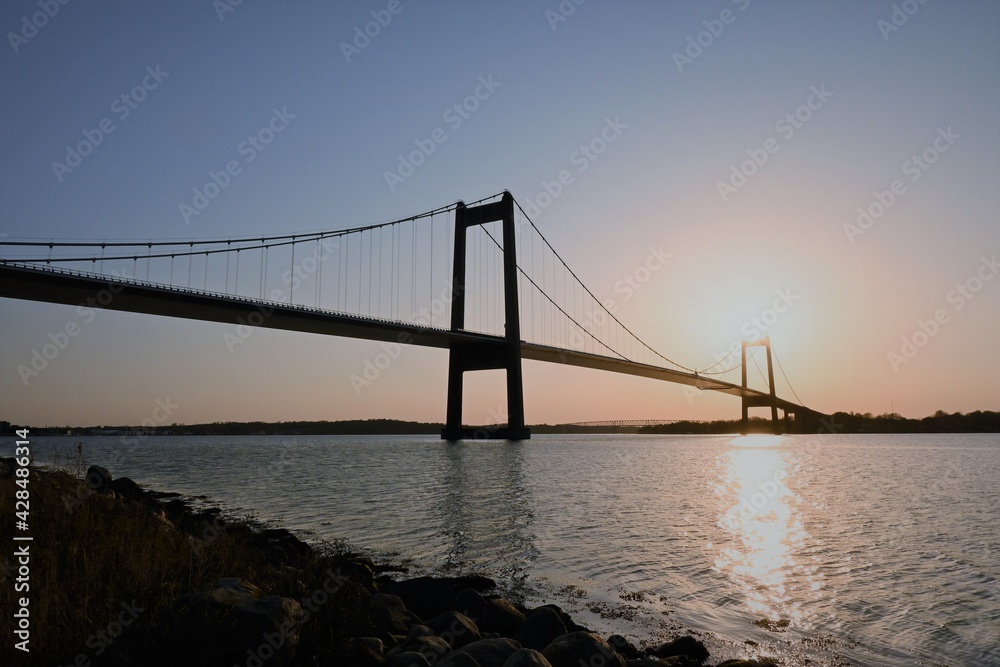 new and old bridge at sunset