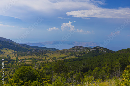 View to Adriatic Sea islands from green mountains of Northern Velebit National park, Croatia