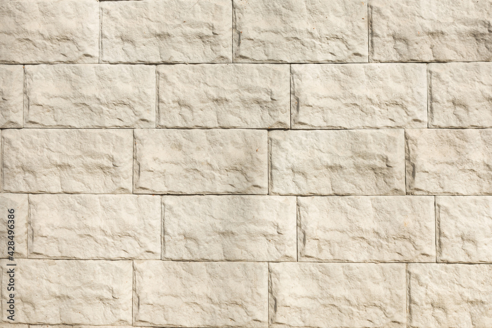 Surface with white tiles with a stone texture for the exterior Surface with white tiles with a stone texture for the exterior