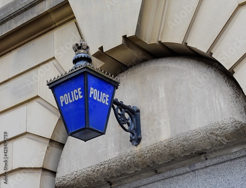 A traditional old blue Police lantern sign