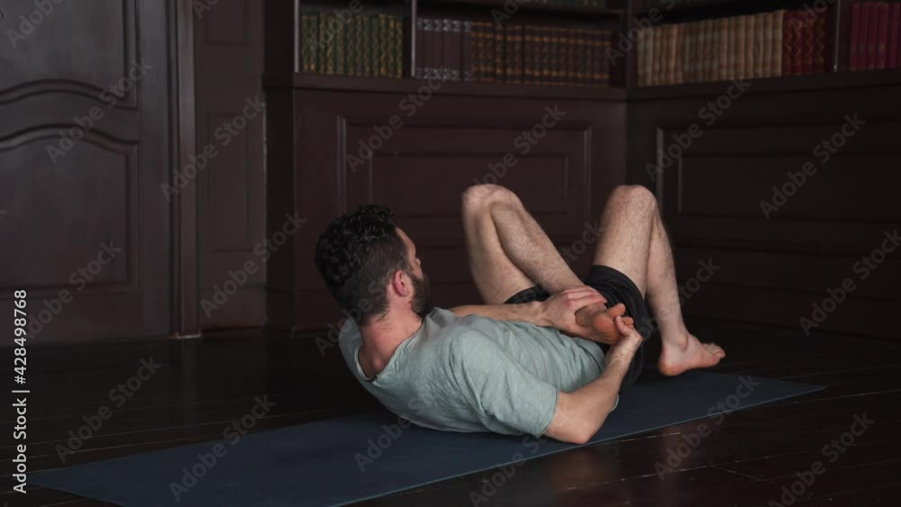 4K video Of Bearded Man Doing Balancing Yoga Exercises Working Out at Home 4K video Of Bearded Man Doing Balancing Yoga Exercises Working Out at Home