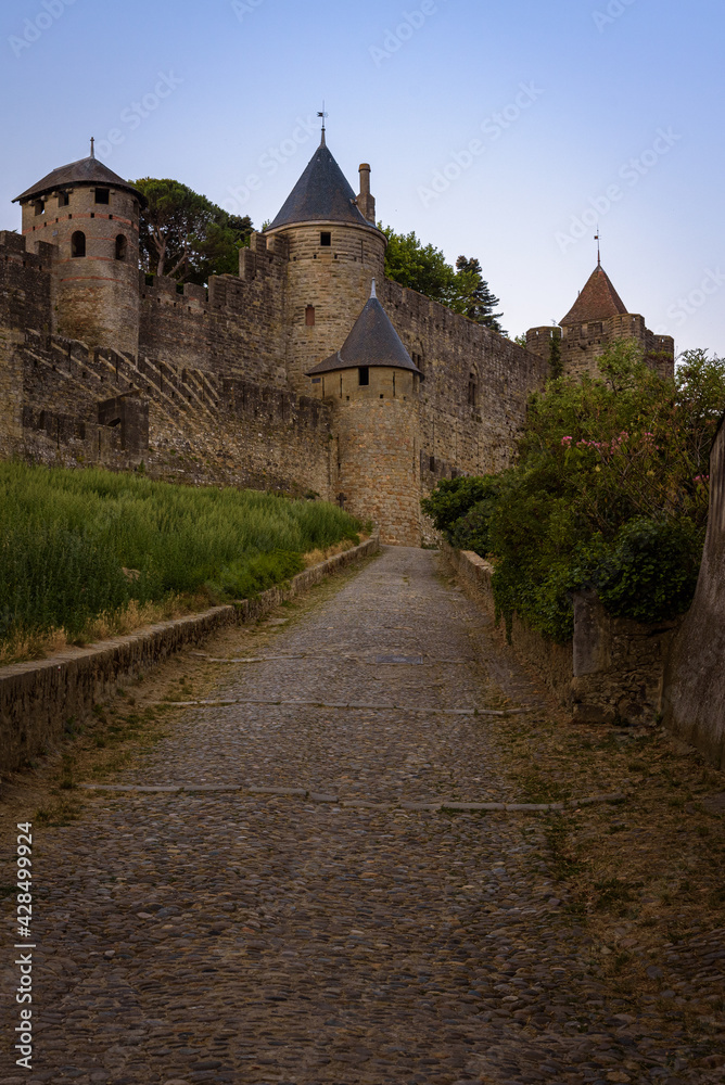 Landscape at sunrise of the access ramp to the castle and the fortified city of Carcassonne, UNESCO World Heritage Site, France