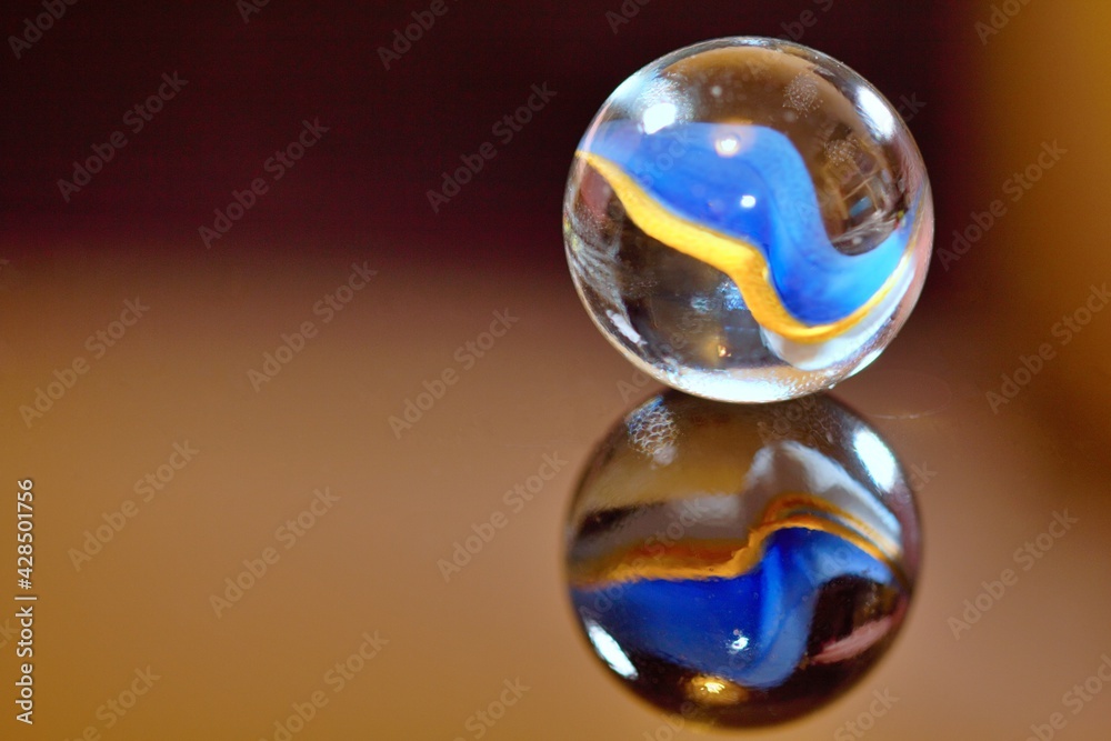 Little marble on the right with two colours - stock photo Little marble on the right with two colours - stock photo