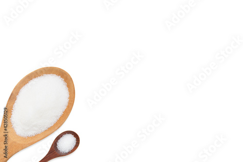 Sugar in two wooden spoons on white background.