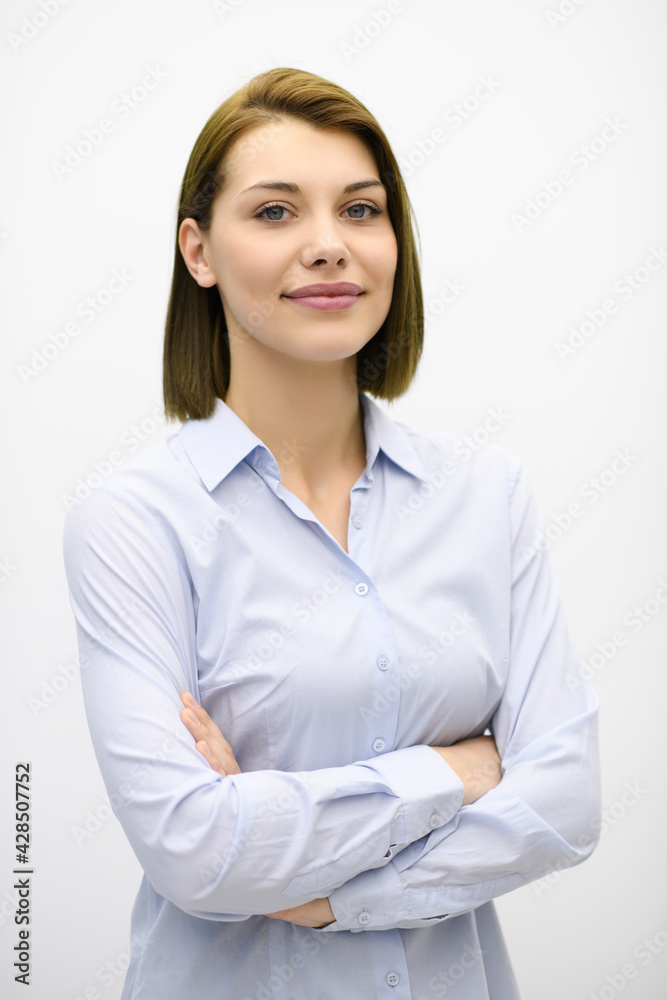 Portrati shot of beautiful blond businesswoman standing with arms crossed at isolated white background. Portrati shot of beautiful blond businesswoman standing with arms crossed at isolated white background.