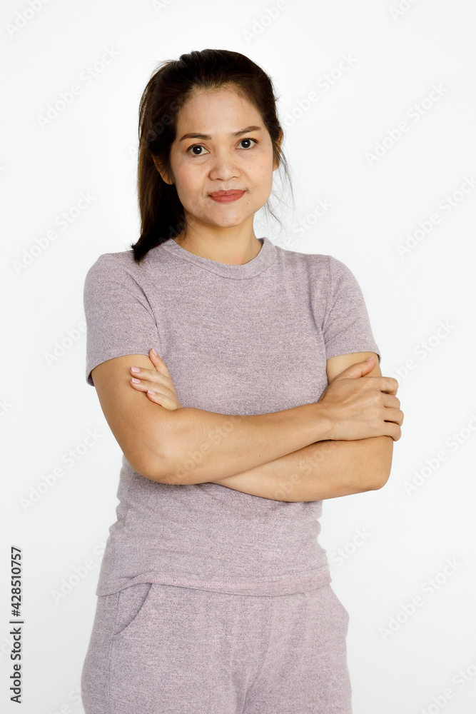 Portrait shot of Asian middle aged happy healthy beautiful long hair senior retirement female housewife wears pink gray cloth stand alone look at camera hands cross on chest on white background Portrait shot of Asian middle aged happy healthy beautiful long hair senior retirement female housewife wears pink gray cloth stand alone look at camera hands cross on chest on white background