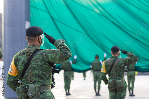 soldiers raising flag