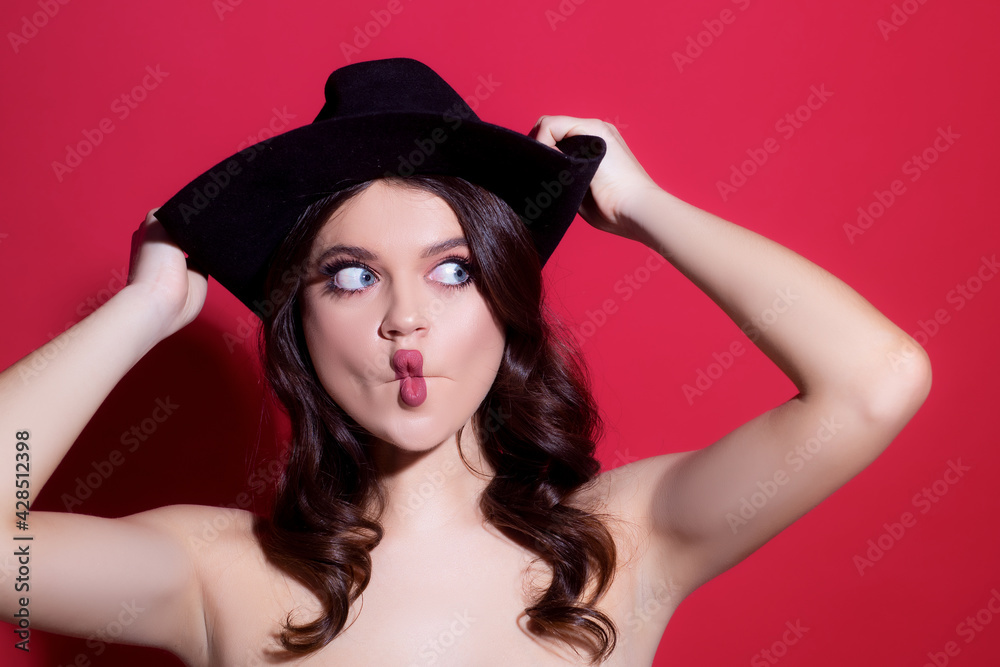 Funny girl portrait. Woman in black hat. Sensual retro fashion. Isolated. High-fashion. Funny girl portrait. Woman in black hat. Sensual retro fashion. Isolated. High-fashion.