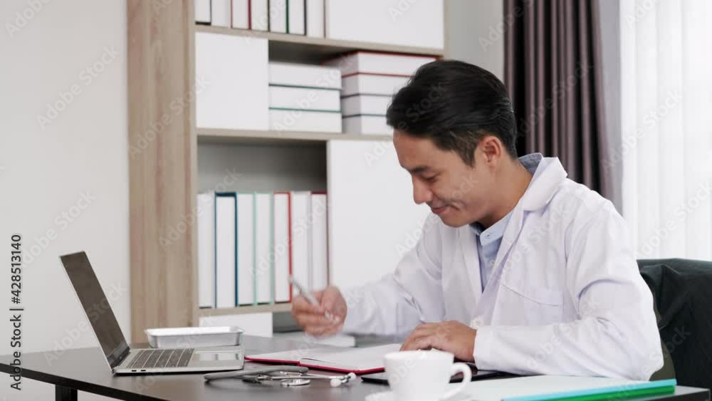 Young doctor giving counseling to patients on Internet laptop Young doctor giving counseling to patients on Internet laptop