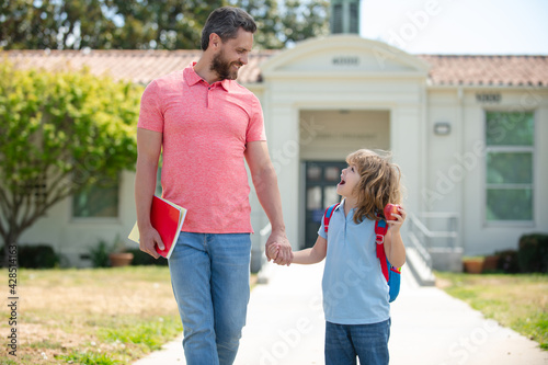 Father and son go to school, education and learning. photo