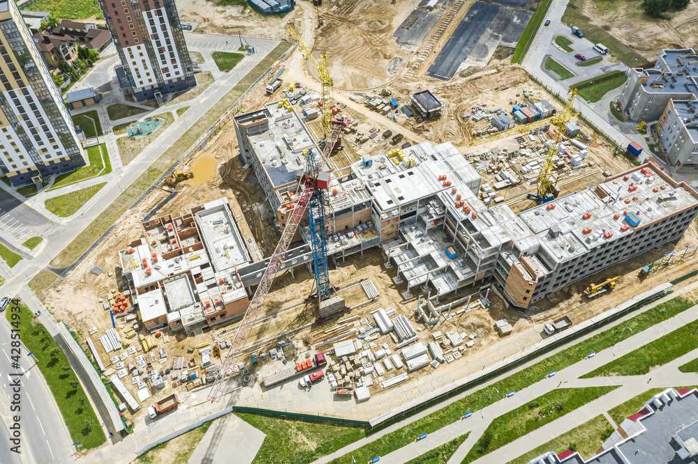 construction of new building in a residential area. aerial view of large construction site.